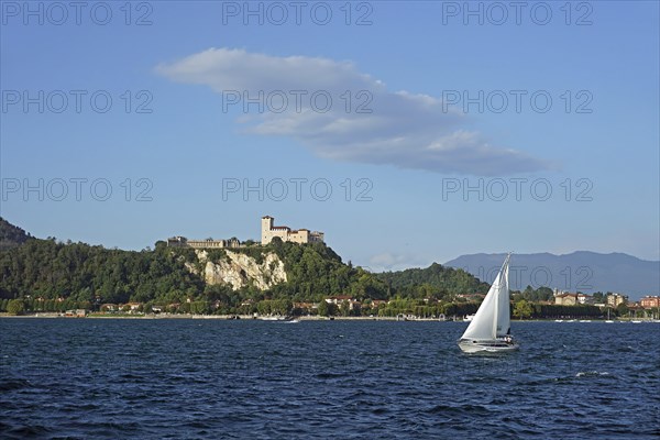 Sailing boat and castle of Angera or Rocca Borromeo di Angera