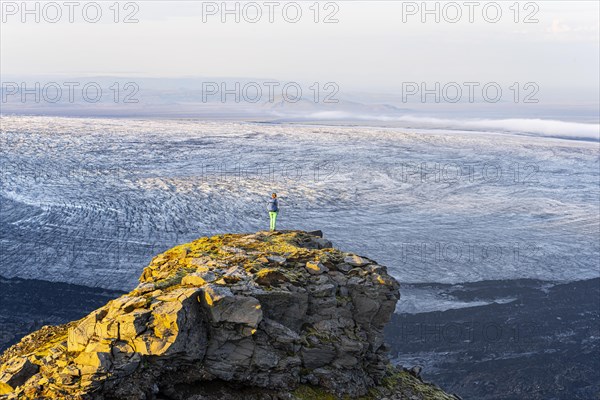 Hiker looks over spectacular landscape