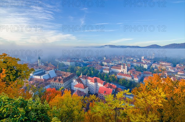 Cityscape of Graz with Mur river and Mariahilfer church