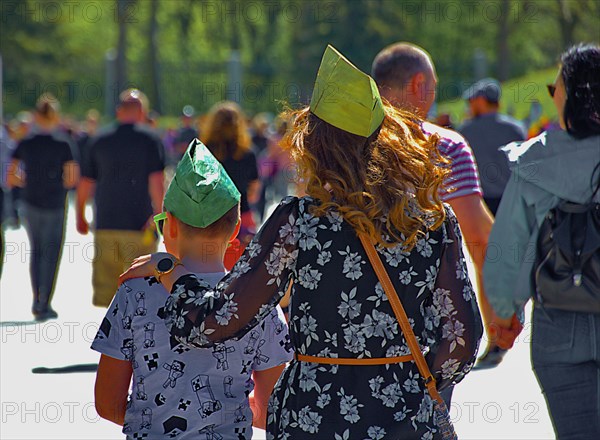 Mother and son on the way to the Soviet Memorial in Treptow Park on Victory Day
