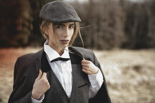 Young woman in dandy style in the meadow