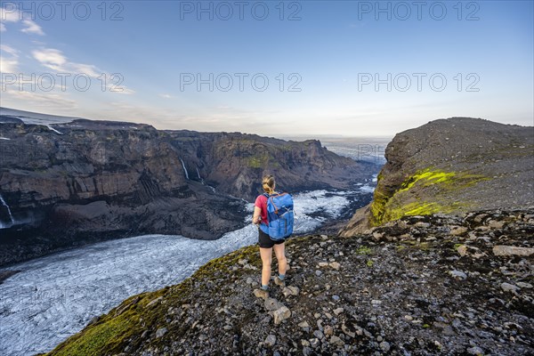 Hiker looks over spectacular landscape