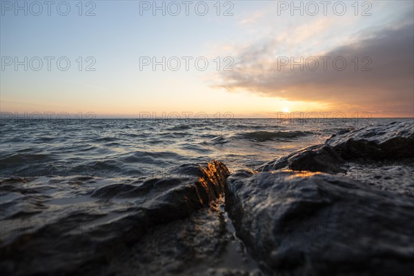 Morning atmosphere with light wind and waves Bank stabilisation in the harbour of Guettingen