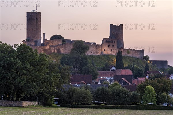 Illuminated castle ruins of the medieval Stauferburg Muenzenberg