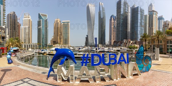 Dubai Marina Logo and Harbour Skyline Architecture Luxury Holiday in Arabia Panorama in Dubai