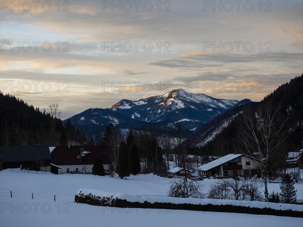 Evening clouds over snow-covered mountains