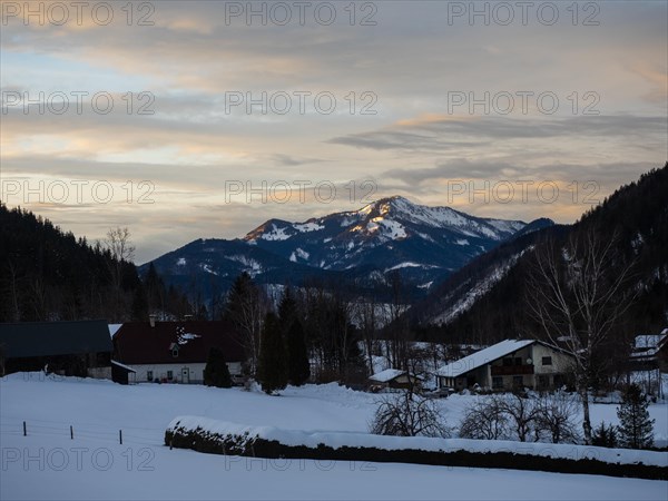 Evening clouds over snow-covered mountains