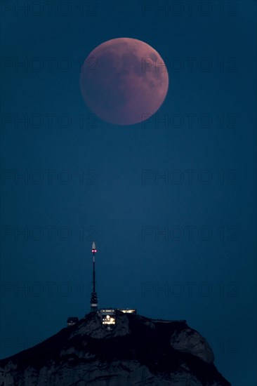 Lunar eclipse above the mountain station of Hohen Kasten