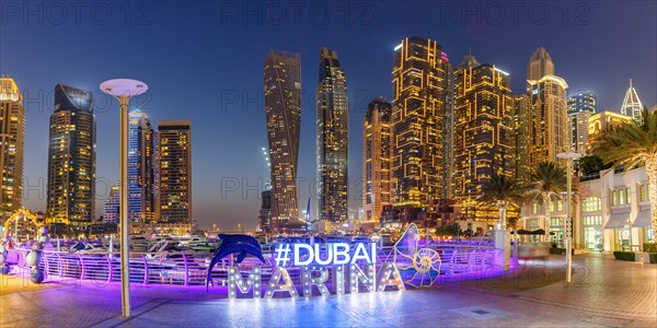 Dubai Marina Logo and Harbour Skyline Architecture Luxury Holiday in Arabia Panorama by Night in Dubai