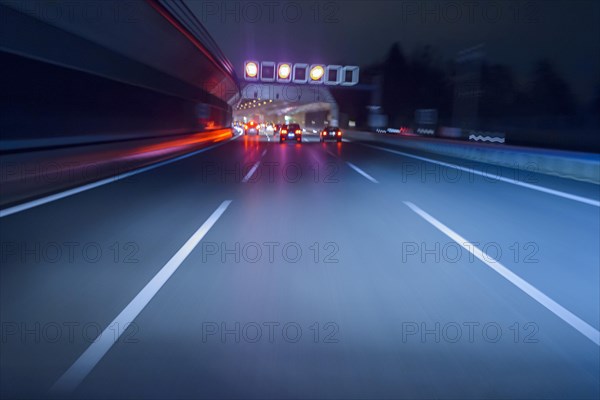 View from a Moving Car at Night on the Highway Tunnel