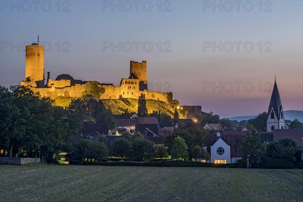 Illuminated castle ruins of the medieval Stauferburg Muenzenberg