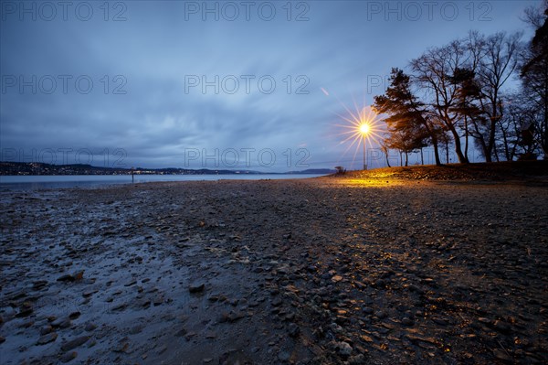 Storm warning light in the morning during a storm at Lake Constance