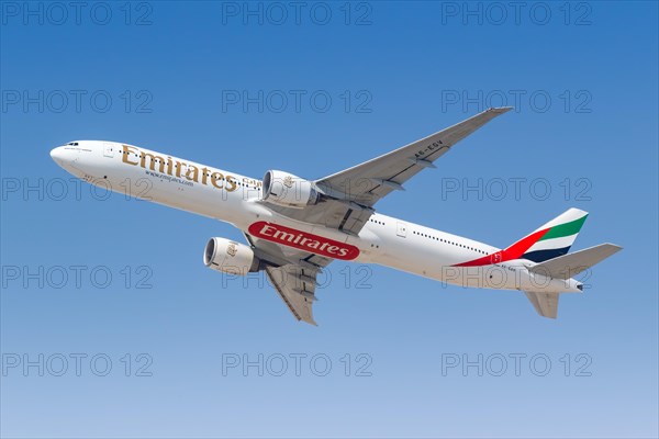 An Emirates Boeing 777-300ER aircraft with registration A6-EQV takes off from Dubai Airport