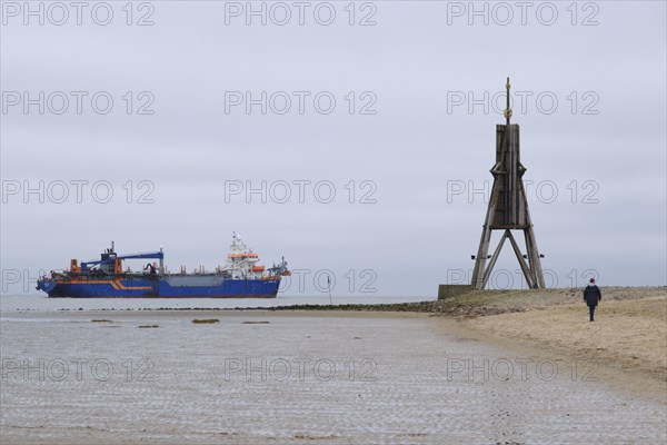 Dredger on the North Sea next to the Kugelbake