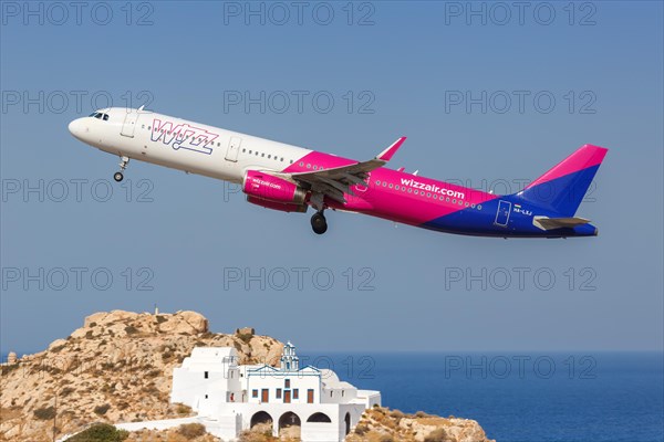 An Airbus A321 aircraft of Wizzair with registration number HA-LXJ at the airport in Santorini
