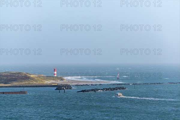 Dune with lighthouse on the beach