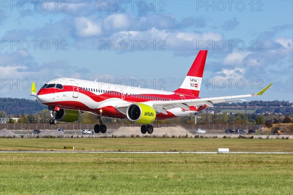 An Air Baltic Airbus A320 with the registration number YL-CSL in the special livery Latvia 100 at the airport in Stuttgart