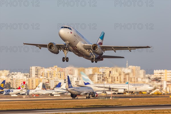 A Eurowings Airbus A319 with the registration D-AGWD at the airport in Faro