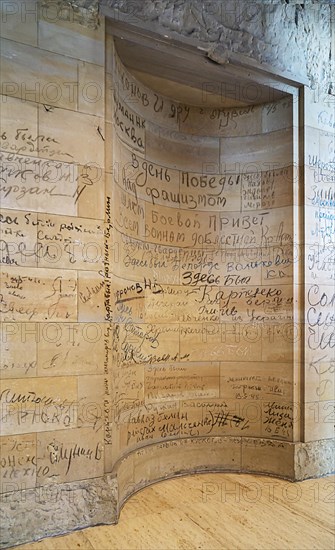 Stone fragments of the 1945 Reichstag ruins reused with original Russian writing