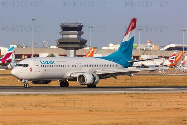 A Luxair Boeing 737-800 aircraft with registration LX-LGV at Faro airport