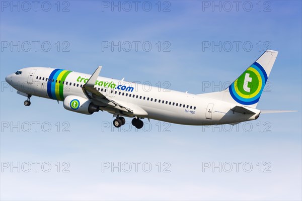 A Transavia Boeing 737-800 with the registration PH-HSE takes off from the airport in Rotterdam