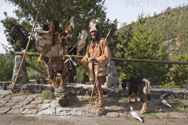 Goat herder in traditional garb