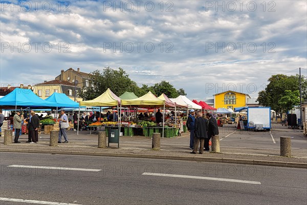 People at a weekly market market