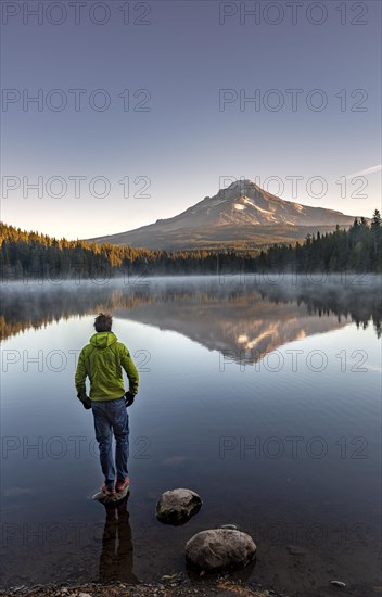 Young man standing on stone