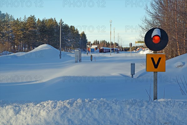 Snow-covered railway line and station