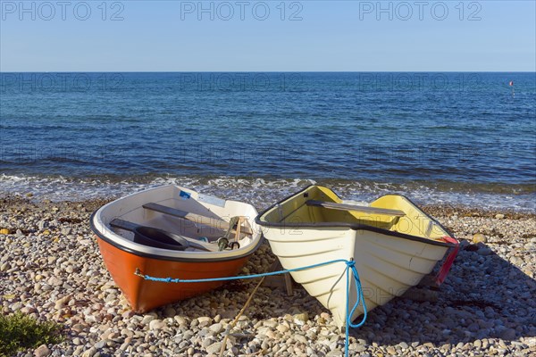 Pebble Beach with Rowing Boats