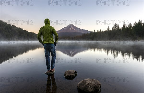 Young man standing on stone
