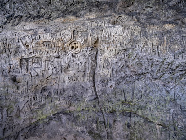 Signs and letters carved in stone on the rock formation Hamburger Wappen