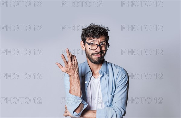 Puzzled man on isolated background