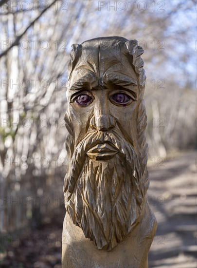 Carved wooden figure at the rock formation Teufelsmauer