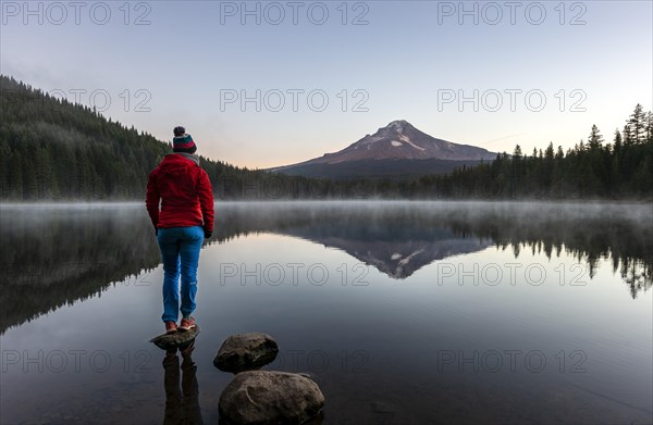 Young woman standing on a stone