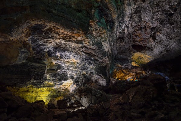 Colourfully illuminated areas of the Cueva de los Verdes