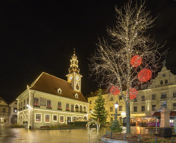 View to the main square with town hall with Christmas lights