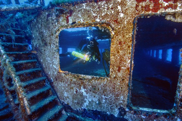 Diver looking through window
