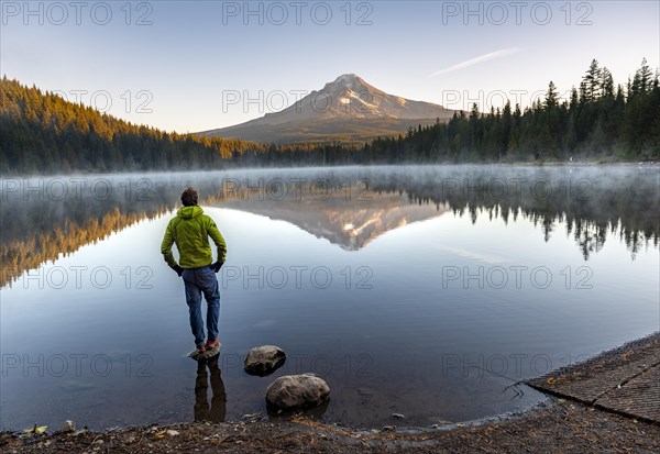 Young man standing on stone