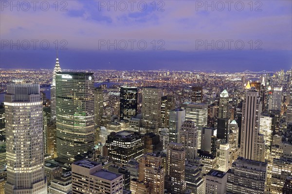 View of Midtown and Downtown Manhattan and Empire State Building from Top of the Rock Observation Center at sunset