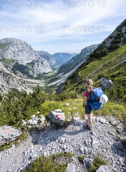 Hiker looking over mountain valley