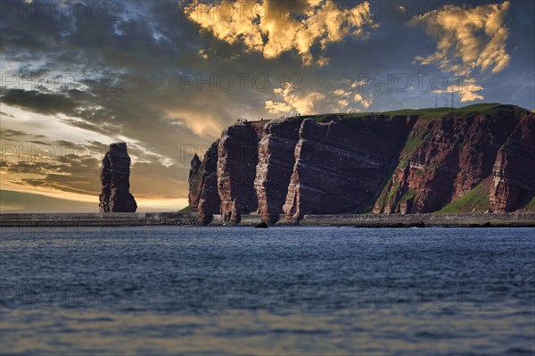 View from the sea to the rocky island of Helgoland with surf pillar Lange Anna