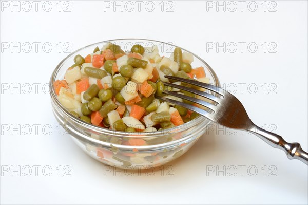 Ingredients for Russian salad in bowl