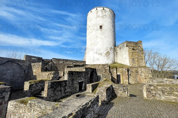 Ruin of foundation walls in former courtyard of Reifferscheid Castle in Eifel