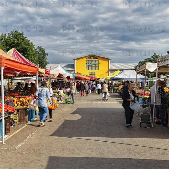 People at a weekly market market