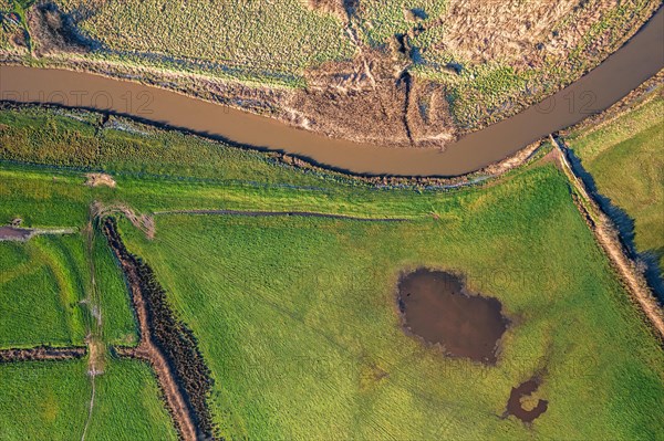 Top Down view from a drone over Meadows and Marshland around Clyst River in Topsham