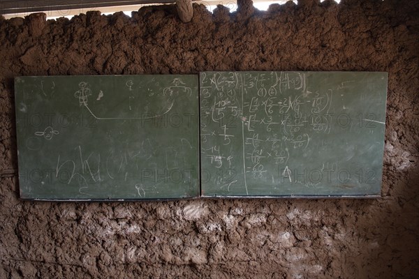 Blackboard in a village school made of clay in Gaza Province