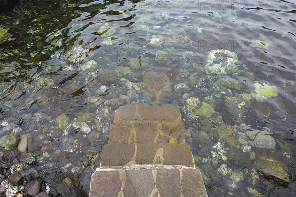 Stairs to natural swimming pool