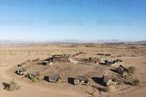 The Doro Nawas Camp and arid desert plains at the edge of the dry river bed of the Aba-Huab river