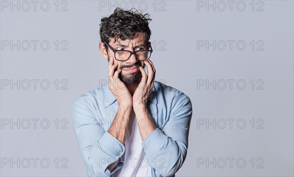 Puzzled man on isolated background